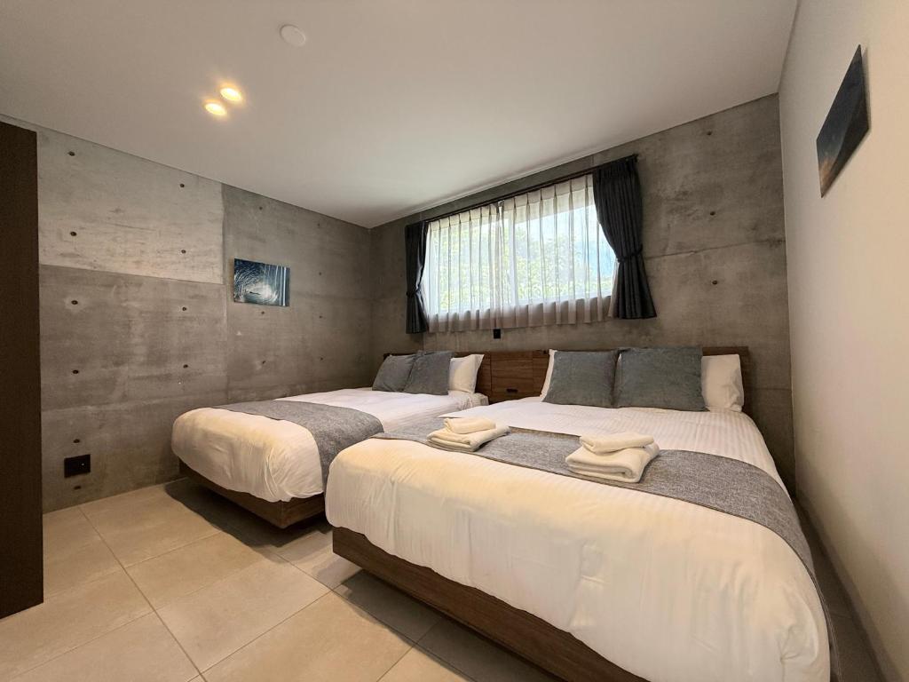 Postel nebo postele na pokoji v ubytování Emerald Ocean Villa