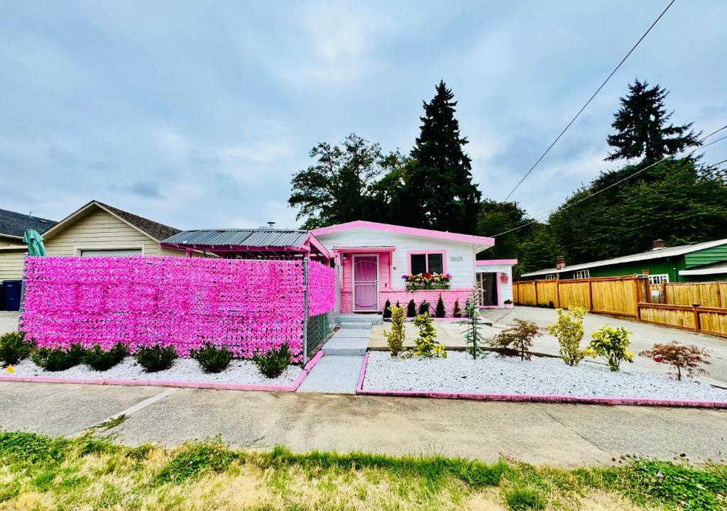 a pink house with a pink fence at 1 Bedroom Apartment 10 Minutes to SeaTac Airport in Seattle