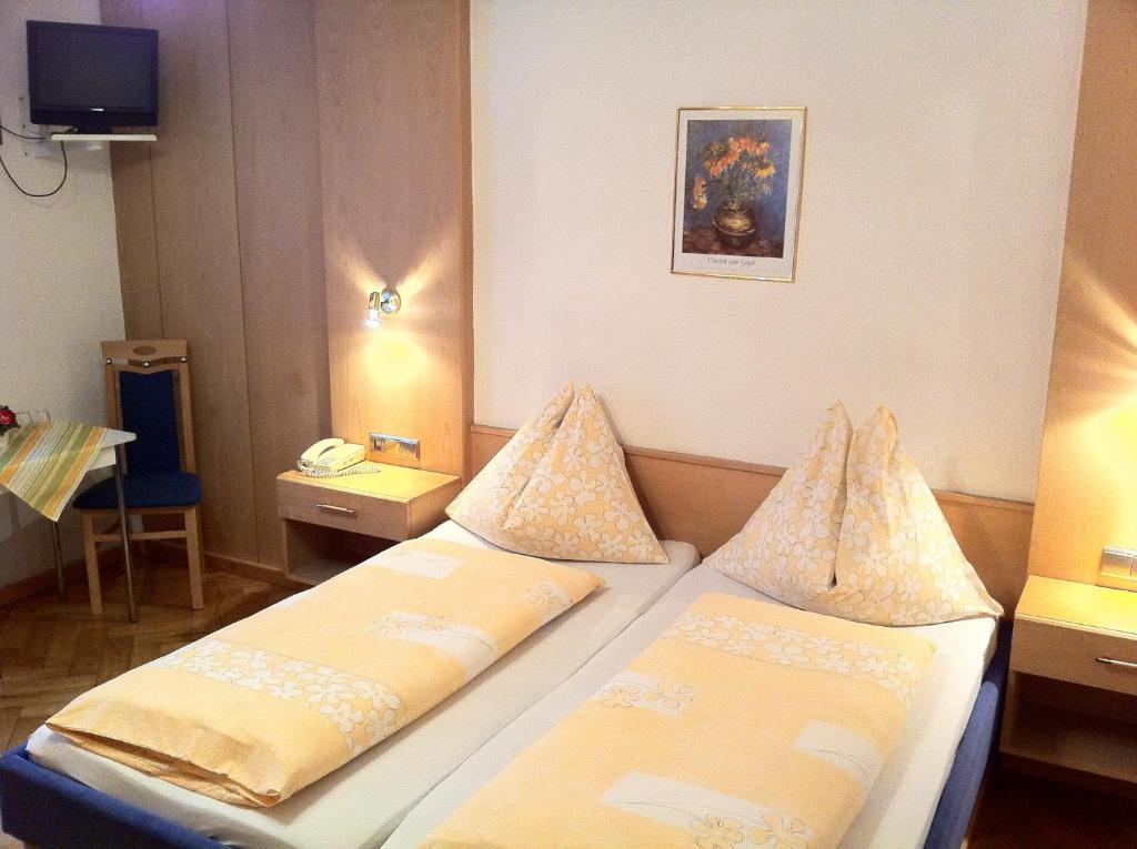 Postel nebo postele na pokoji v ubytování Hotel Tautermann