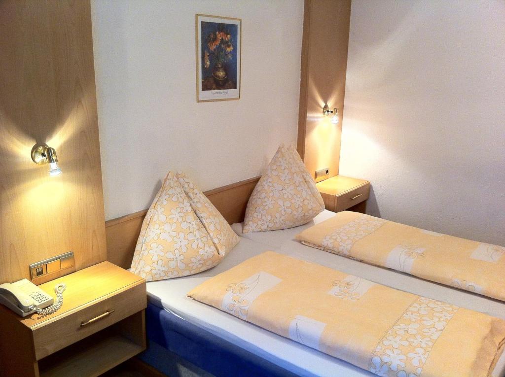 Postel nebo postele na pokoji v ubytování Hotel Tautermann