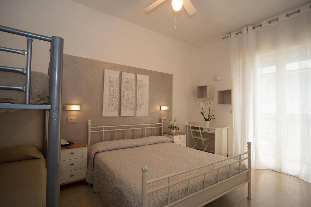Postel nebo postele na pokoji v ubytování Hotel Conchiglia