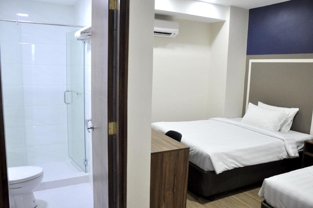 Postel nebo postele na pokoji v ubytování S Hotel & Residences