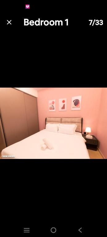 a picture of a bedroom with a white bed at Eaton kl,2R1B,klcc,500mbps,2-4pax in Kuala Lumpur