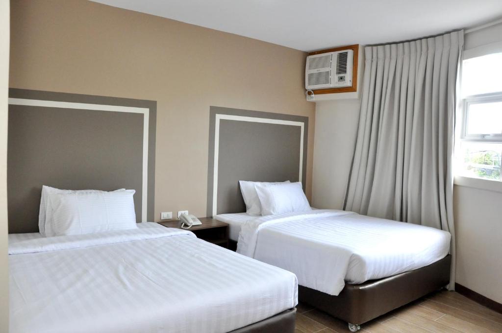 Postel nebo postele na pokoji v ubytování S Hotel & Residences