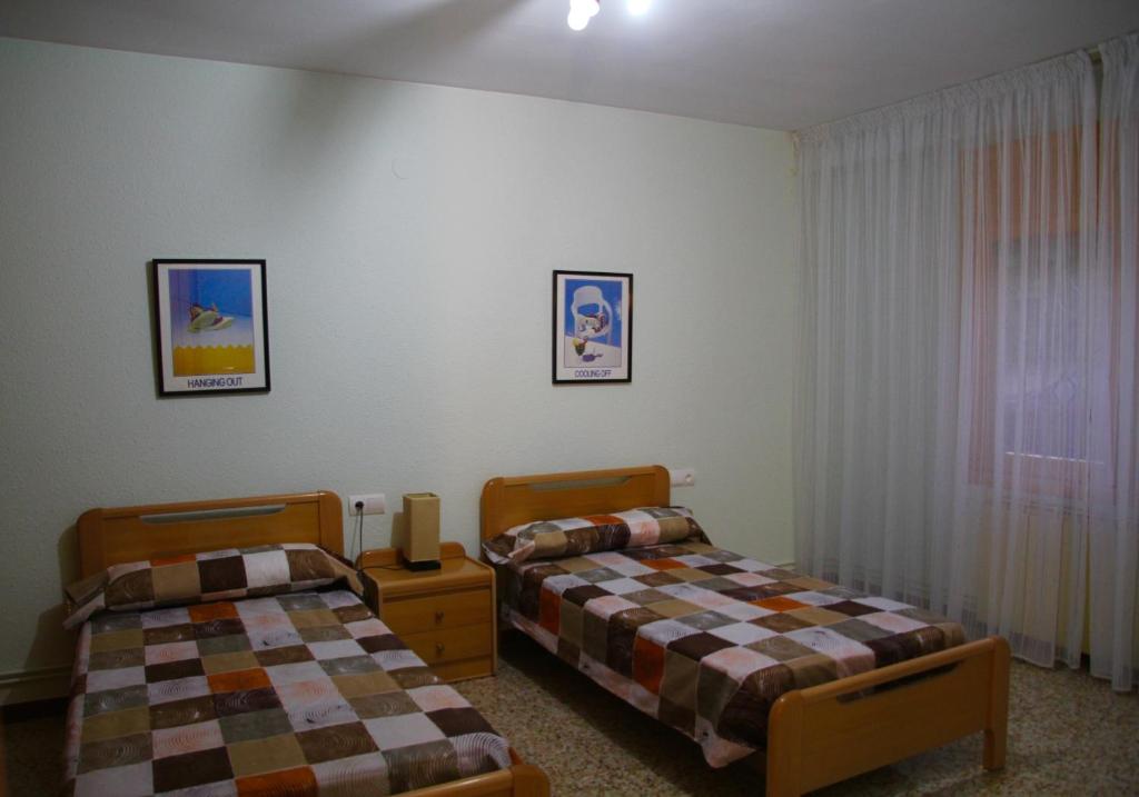 Postel nebo postele na pokoji v ubytování CASA LA FÀBRICA
