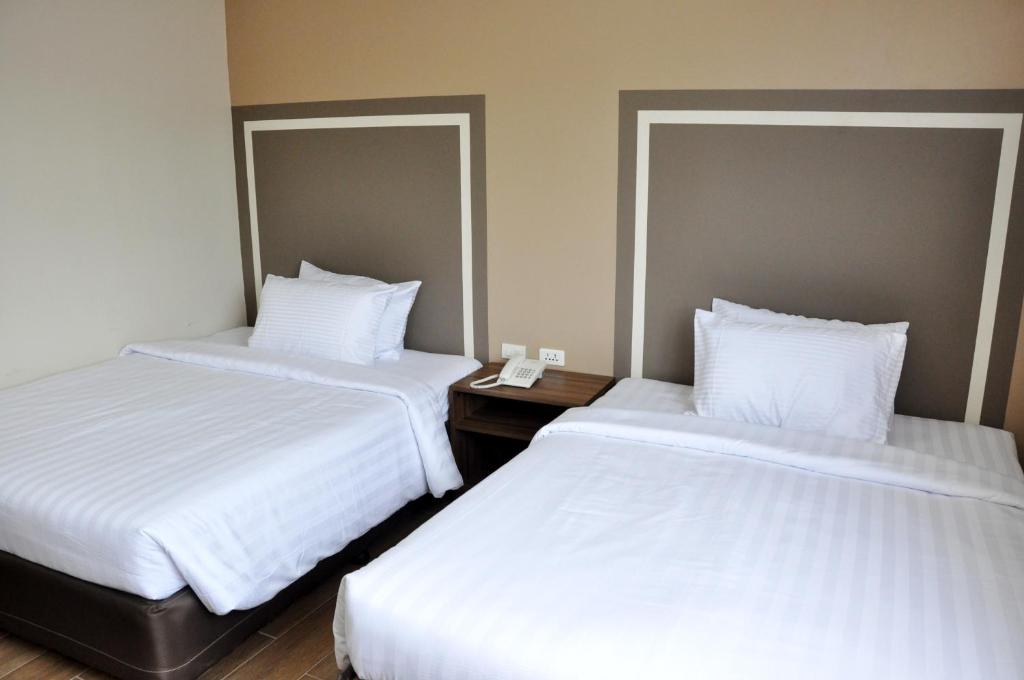 Postel nebo postele na pokoji v ubytování S Hotel & Residences