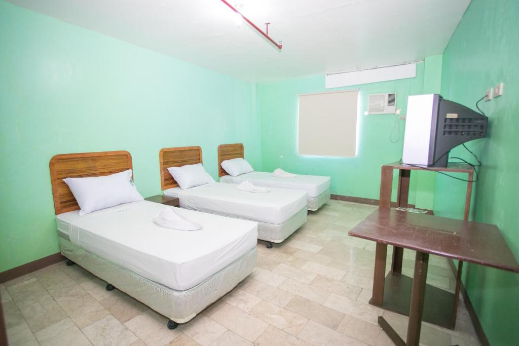 Postel nebo postele na pokoji v ubytování GV Hotel - Dipolog