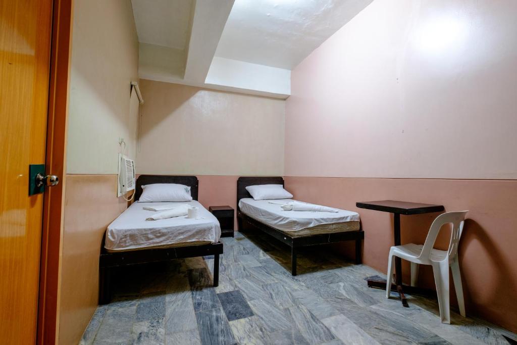 Postel nebo postele na pokoji v ubytování GV Hotel - Ozamiz