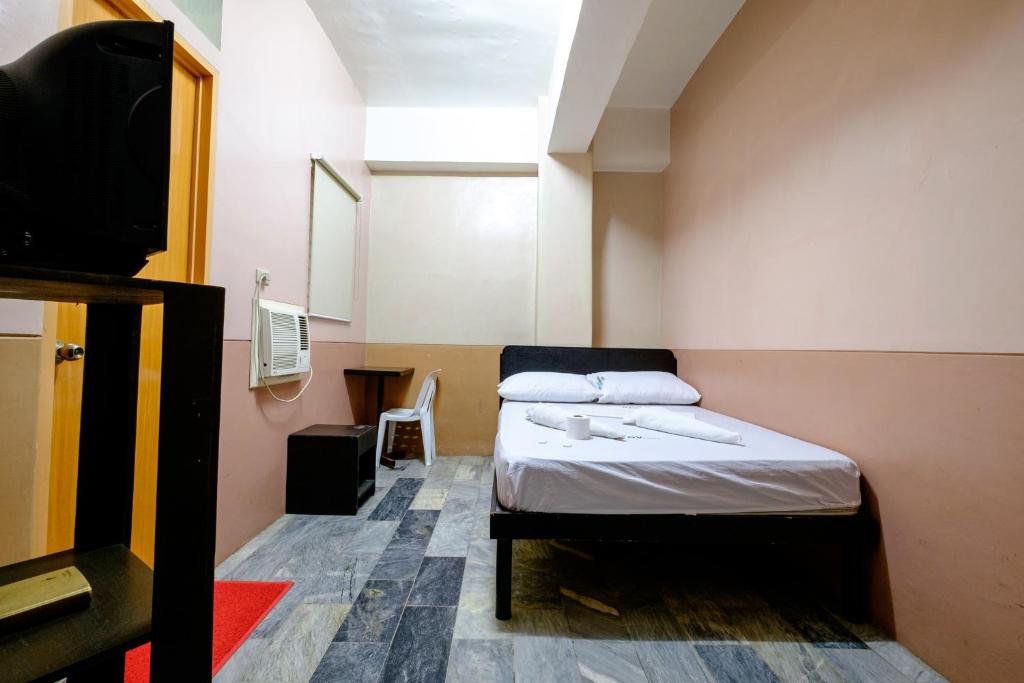 Postel nebo postele na pokoji v ubytování GV Hotel - Ozamiz