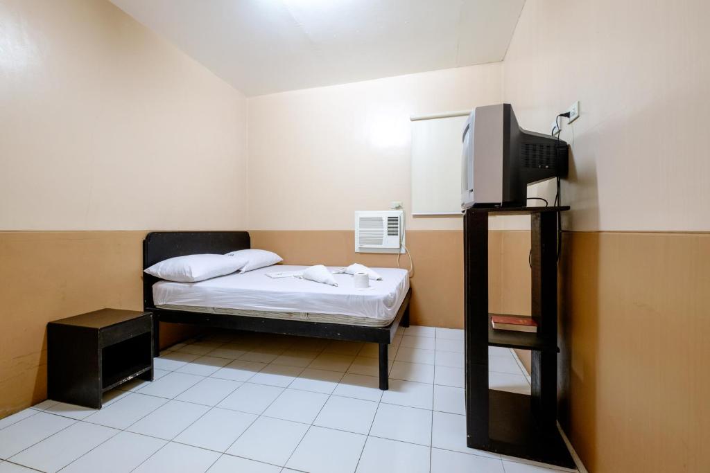 Postel nebo postele na pokoji v ubytování GV Hotel - Ozamiz