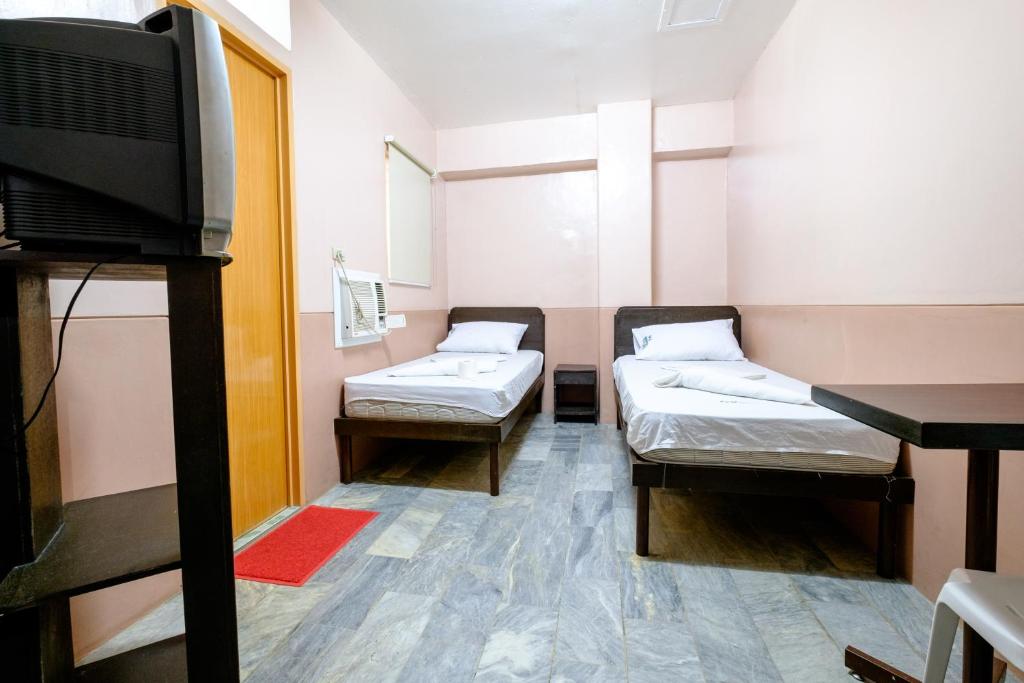 Postel nebo postele na pokoji v ubytování GV Hotel - Ozamiz