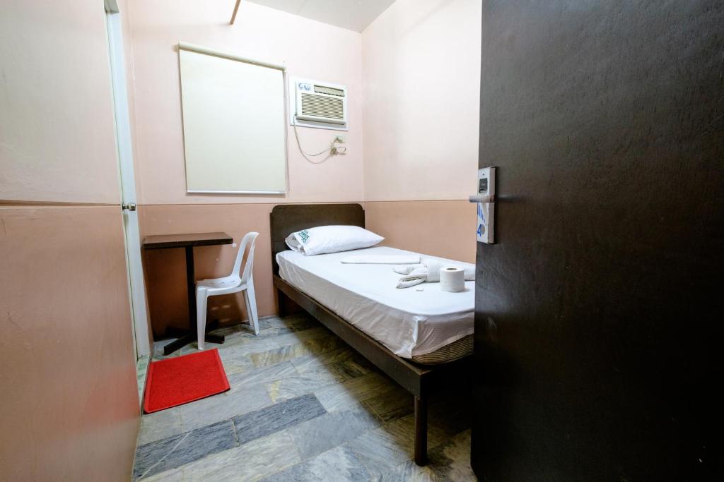 Postel nebo postele na pokoji v ubytování GV Hotel - Ozamiz
