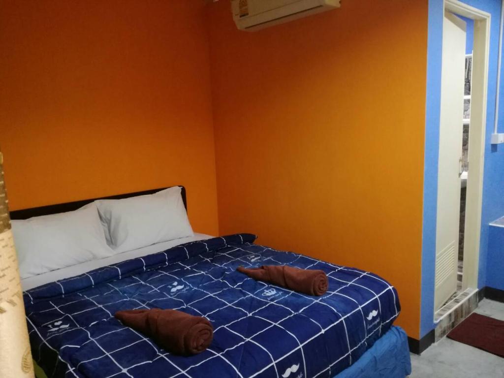 Postel nebo postele na pokoji v ubytování Rc Guest House