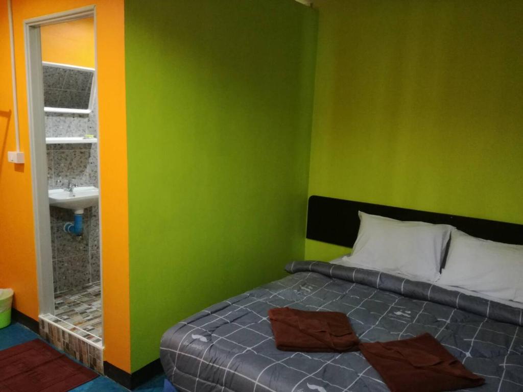 Postel nebo postele na pokoji v ubytování Rc Guest House