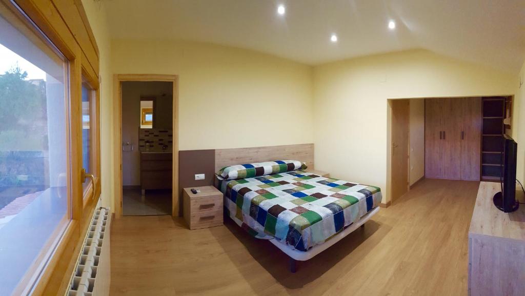 Postel nebo postele na pokoji v ubytování CASA LA FÀBRICA