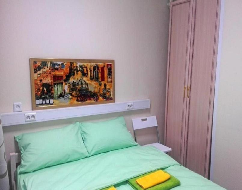Postel nebo postele na pokoji v ubytování KarawanSaraj-parking