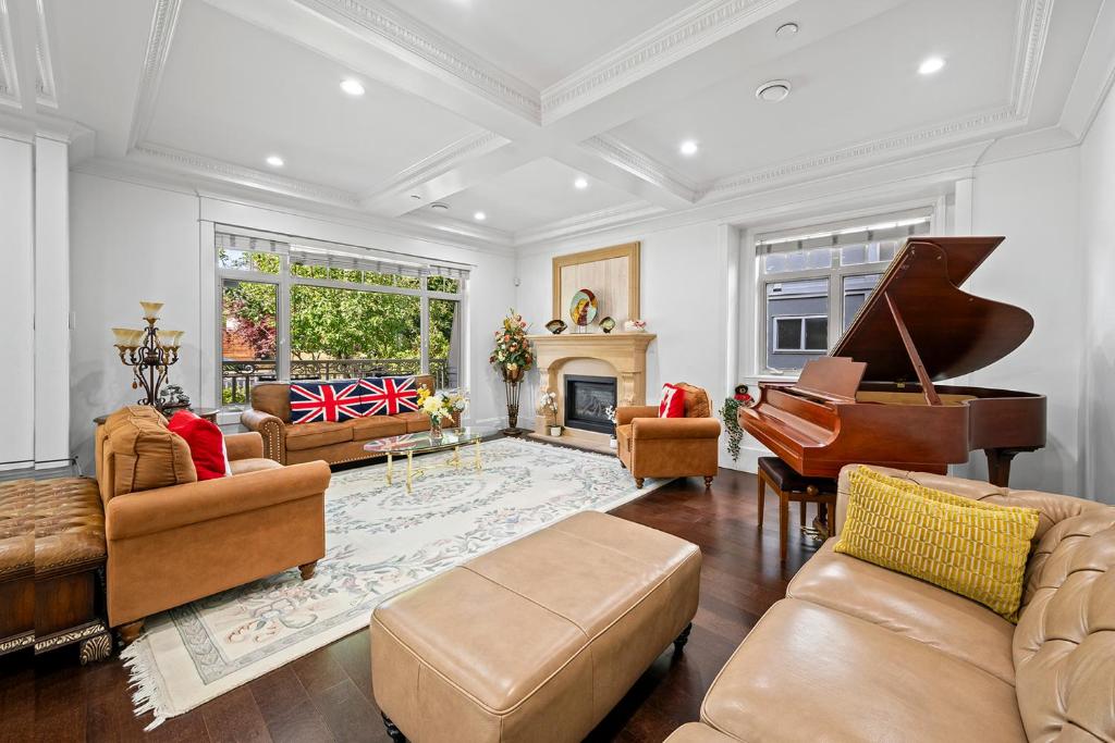 a living room with a piano and a couch at 1 Bedroom Luxury Retreat in Prime Vancouver in Vancouver
