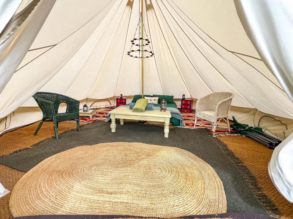 a room with a tent with chairs and a table at Water Vole - Uk49931 in Shadoxhurst
