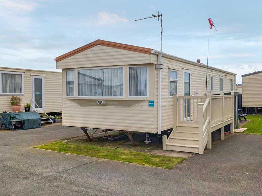 a tiny house is parked in a parking lot at Amanda in Kinmel Bay