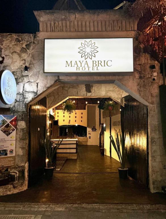 a entrance to aarmaarmaarmaarma restaurant at night at Maya Bric in Playa del Carmen
