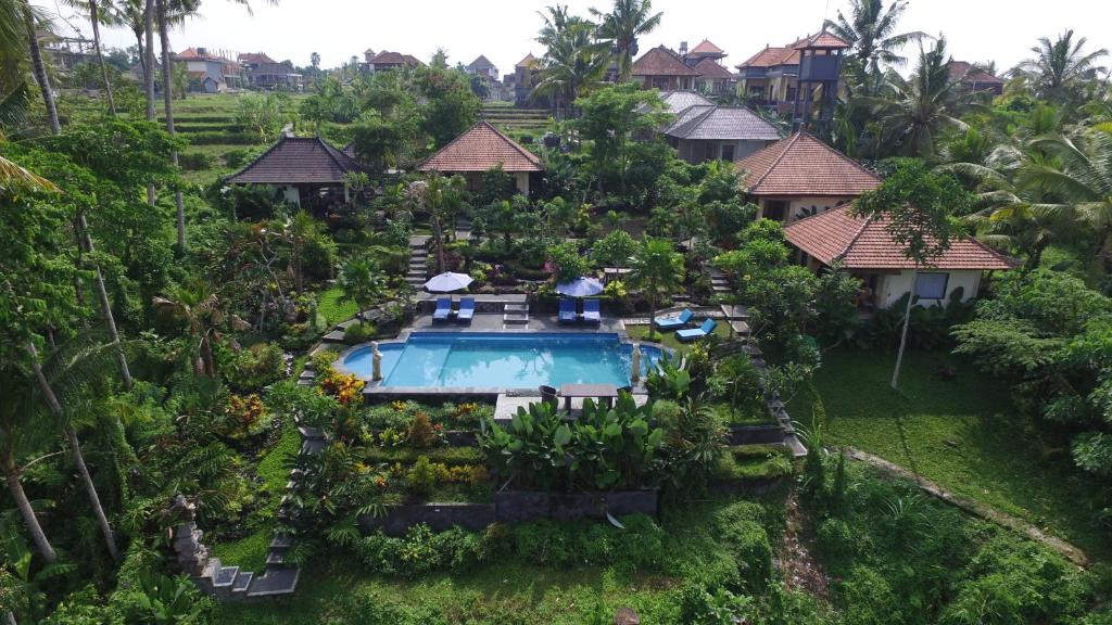 an aerial view of a resort with a swimming pool at Villa Capung Mas Ubud in Ubud