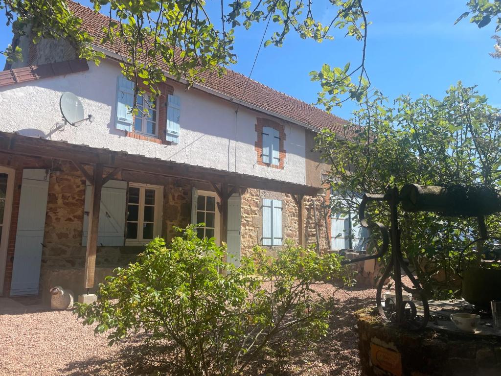 a stone house with a cat sitting in front of it at Villa Souvenir, Lenax in Lenax