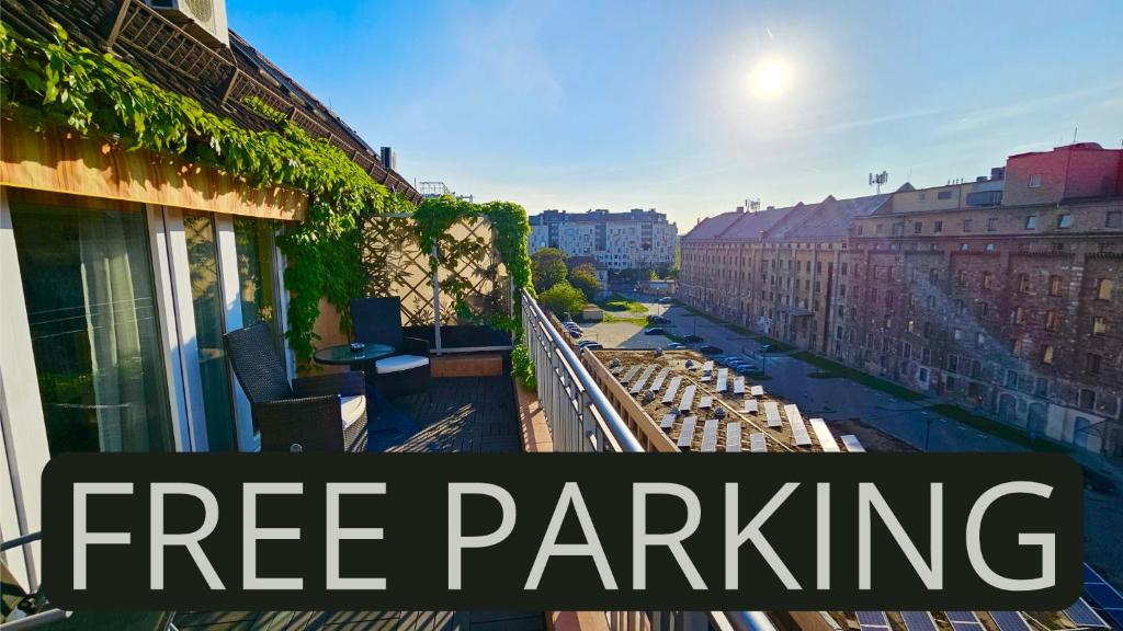 a free parking sign on a balcony of a building at Dandár Family Residence Free Parking in Budapest