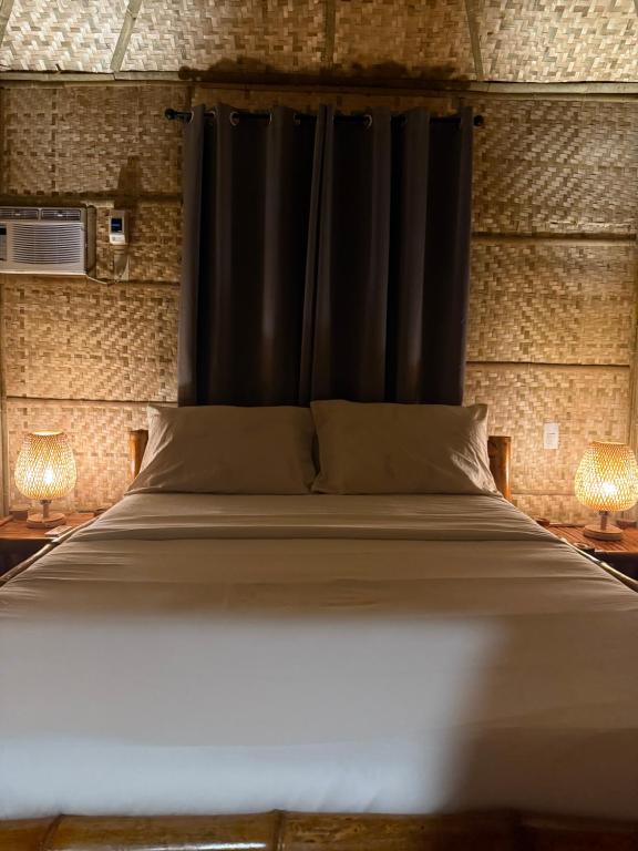 Ένα ή περισσότερα κρεβάτια σε δωμάτιο στο The Bamboo Villas 1