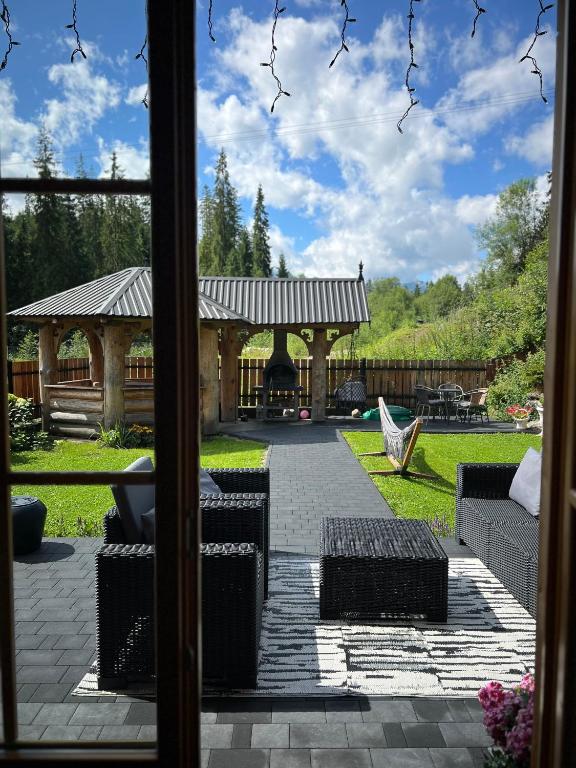 a view of a garden with a gazebo at Góralski Domek Sucha Woda in Małe Ciche