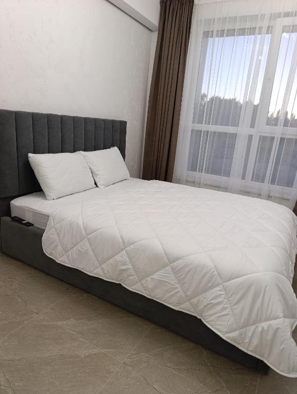 Postel nebo postele na pokoji v ubytování Апартаменти Ашан Автовокзал Стрийська