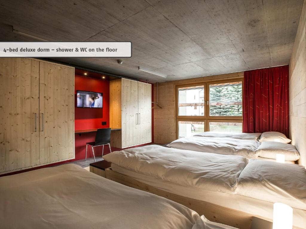 Postel nebo postele na pokoji v ubytování All In One Hotel - Inn Lodge / Swiss Lodge