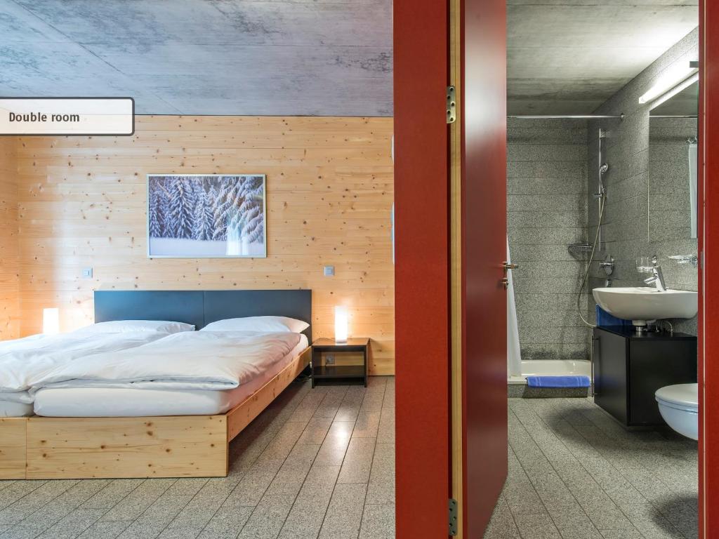 Postel nebo postele na pokoji v ubytování All In One Hotel - Inn Lodge / Swiss Lodge