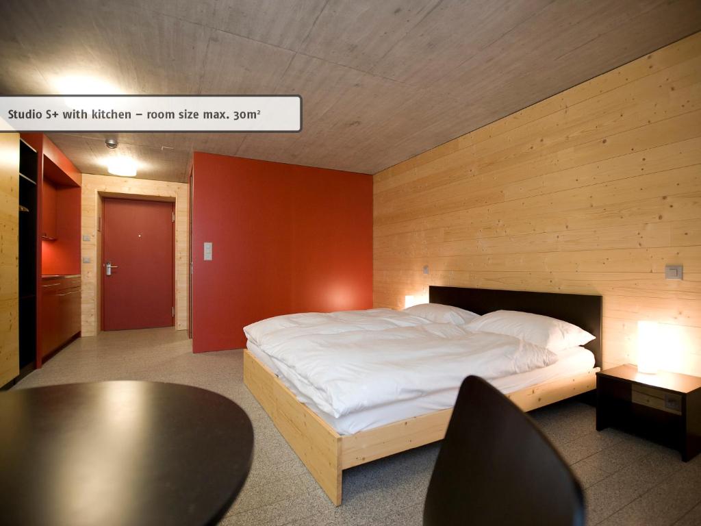 Postel nebo postele na pokoji v ubytování All In One Hotel - Inn Lodge / Swiss Lodge