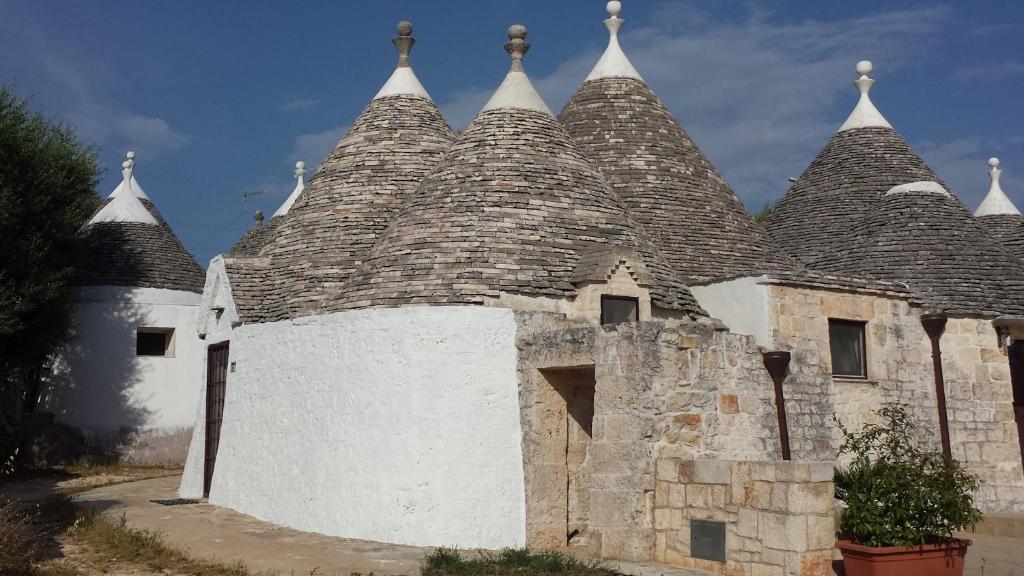 a building with a roof with many turrets at Trulli Manuela in Locorotondo