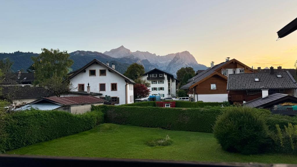 a view of a village with houses and mountains at Studio Bergblick 5 in Garmisch-Partenkirchen