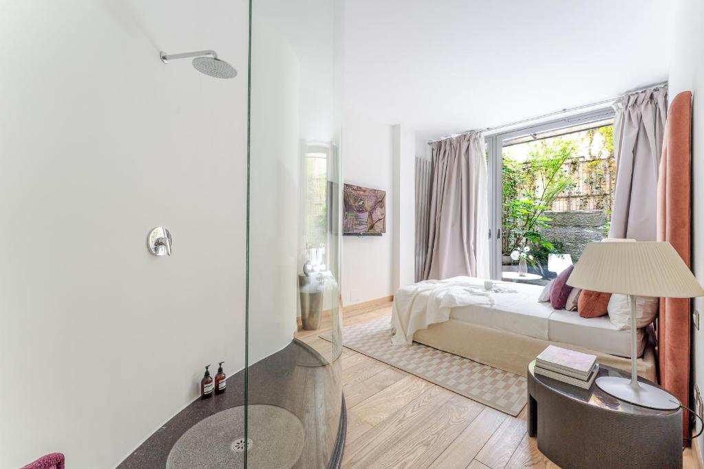 Ένα ή περισσότερα κρεβάτια σε δωμάτιο στο BreraPrivata - appartamento con giardino e spa ad uso esclusivo - Milano