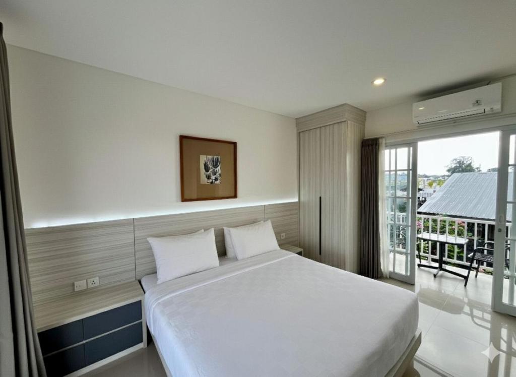 Ένα ή περισσότερα κρεβάτια σε δωμάτιο στο Artha Villa Pererenan By Fays Hospitality