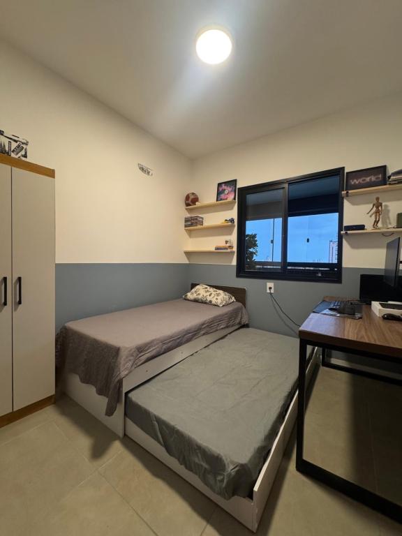 Katil atau katil-katil dalam bilik di Apartamento no centro COP30