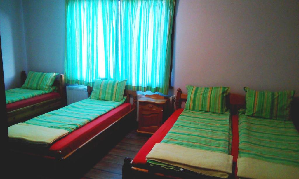 Postel nebo postele na pokoji v ubytování Guest House Lorian