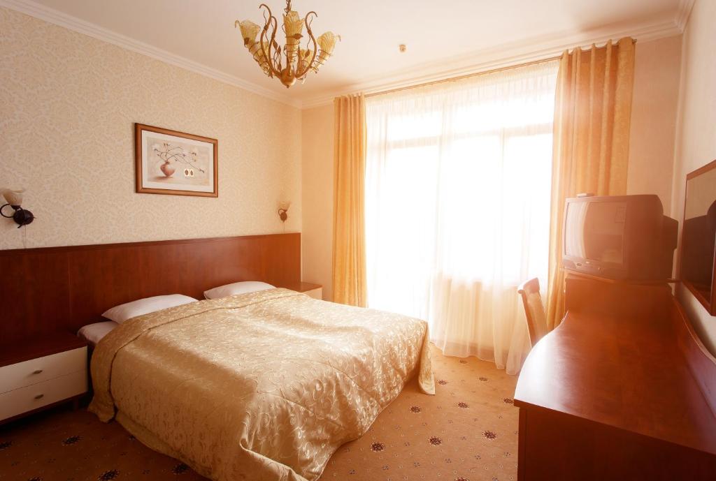 Postel nebo postele na pokoji v ubytování Pansionat Paradiz