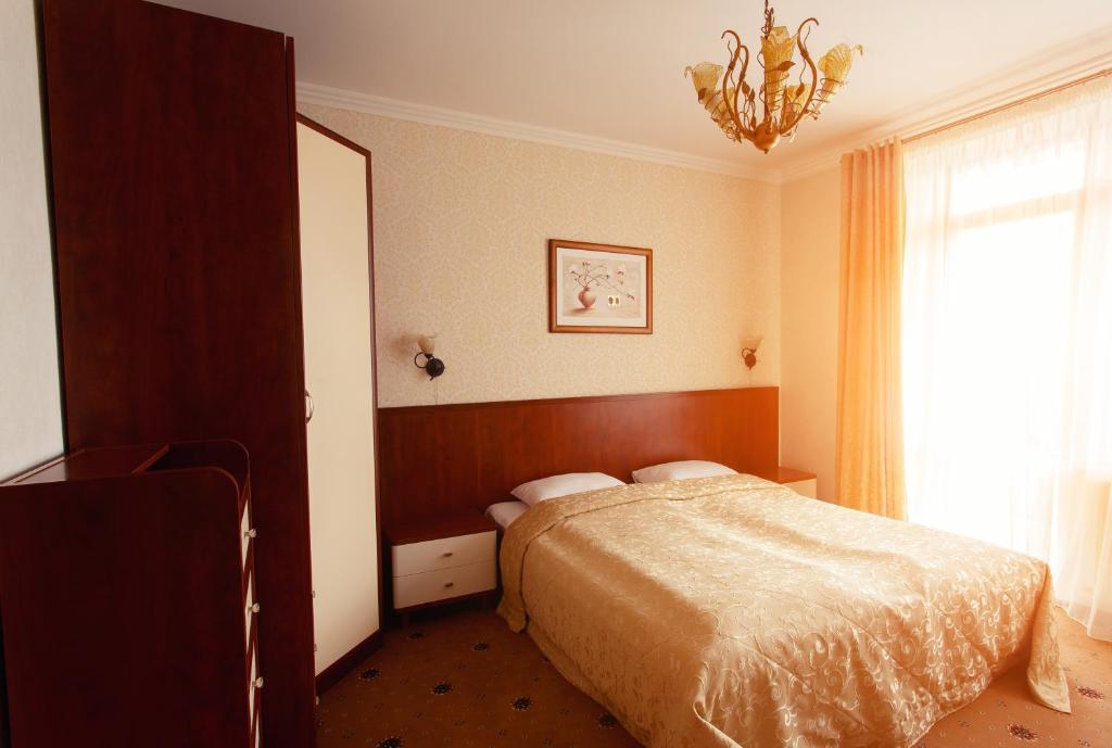 Postel nebo postele na pokoji v ubytování Pansionat Paradiz