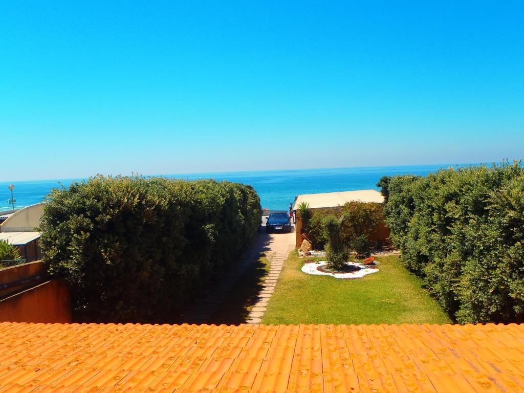 a view from the roof of a house with the ocean at Blue Ocean in Póvoa de Varzim