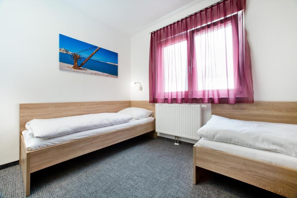 Postel nebo postele na pokoji v ubytování Cleverhotel