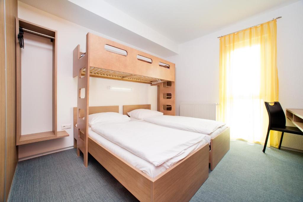 Postel nebo postele na pokoji v ubytování Cleverhotel
