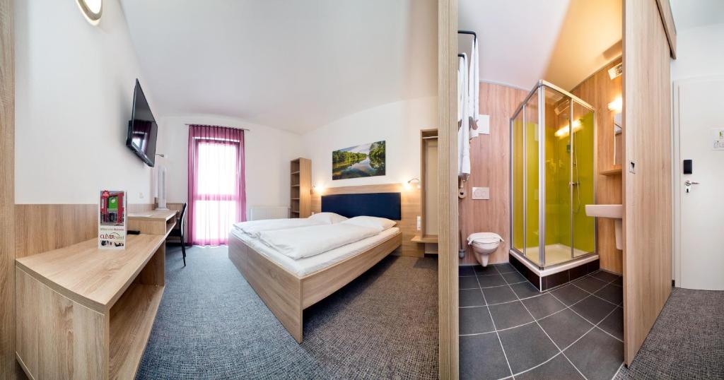 Postel nebo postele na pokoji v ubytování Cleverhotel