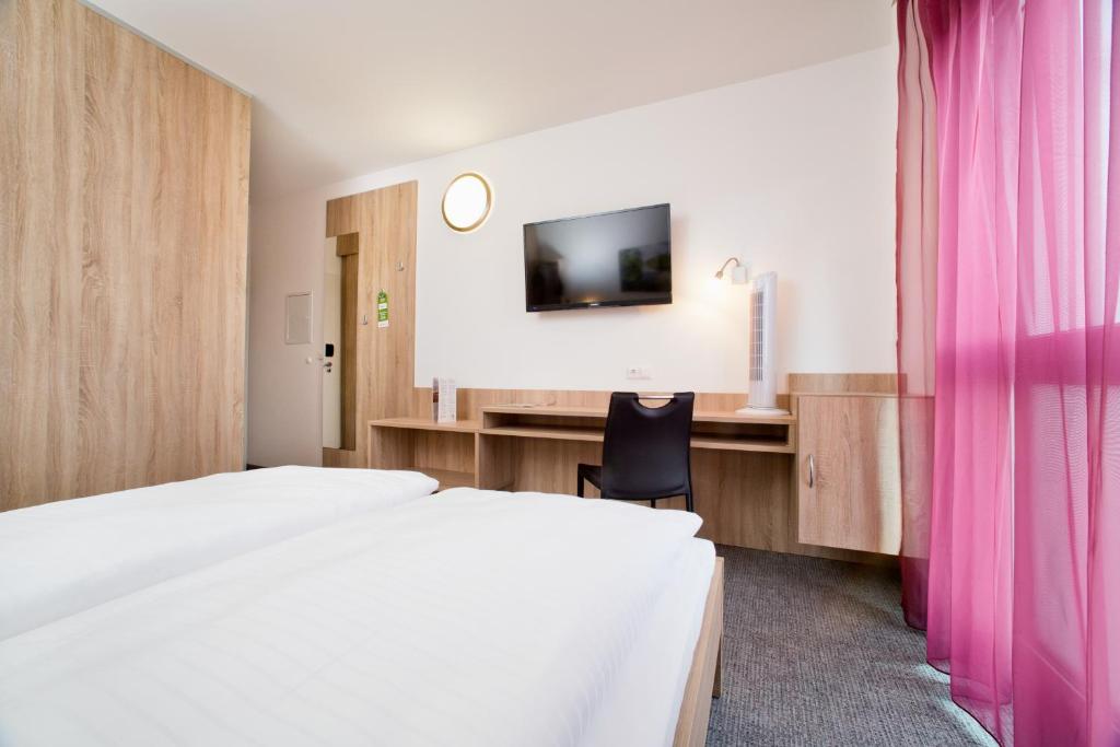 Postel nebo postele na pokoji v ubytování Cleverhotel