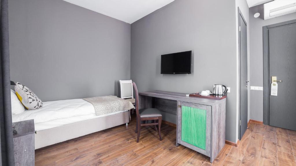 Postel nebo postele na pokoji v ubytování Hotel Gino Wellness Mtskheta