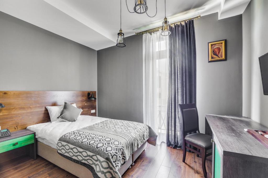 Postel nebo postele na pokoji v ubytování Hotel Gino Wellness Mtskheta