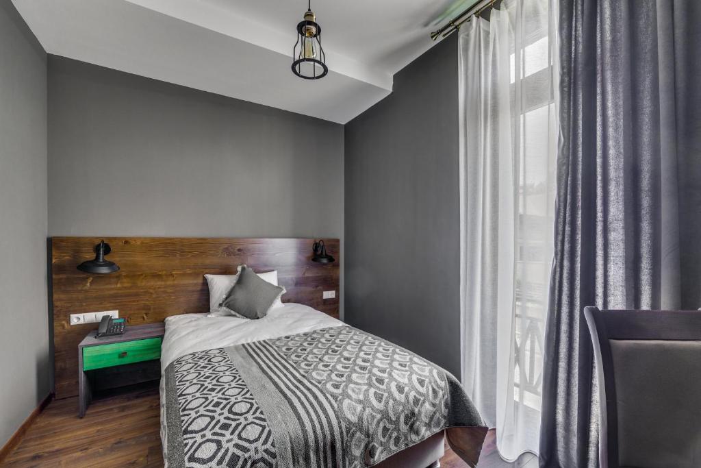 Postel nebo postele na pokoji v ubytování Hotel Gino Wellness Mtskheta