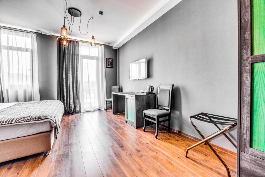 Postel nebo postele na pokoji v ubytování Hotel Gino Wellness Mtskheta